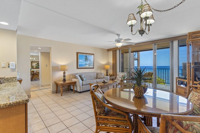 3723 Lower Honoapiilani Rd Unit 302, Lahaina, HI 96761 - dining space with a chandelier, light tile patterned flooring, ceiling fan, a water view, and recessed lighting