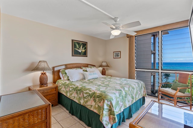 bedroom with ceiling fan and light tile patterned floors