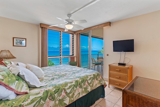 tiled bedroom featuring ceiling fan and access to exterior