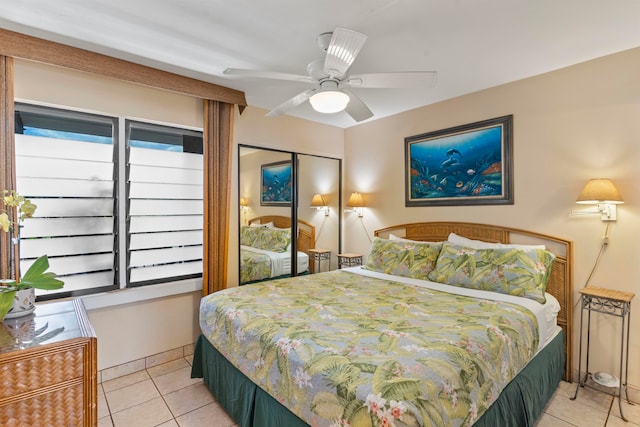 tiled bedroom with a closet and ceiling fan