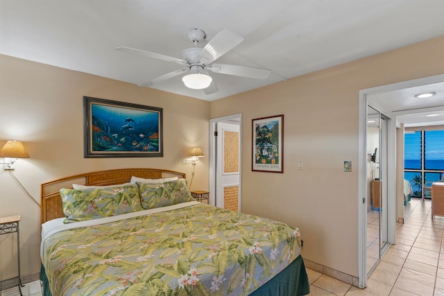 bedroom featuring ceiling fan and light tile patterned floors