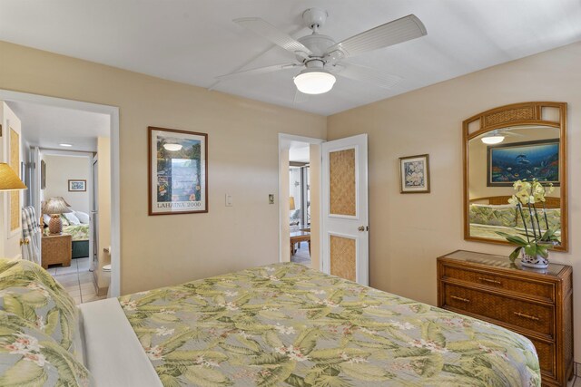 3723 Lower Honoapiilani Rd Unit 302, Lahaina, HI 96761 - bedroom featuring light tile patterned floors, a ceiling fan, and connected bathroom
