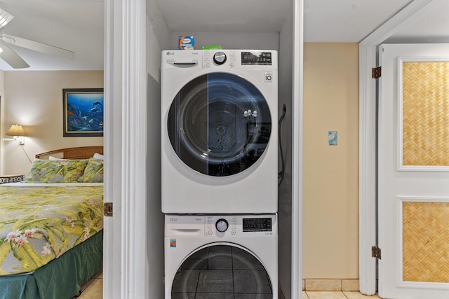 3723 Lower Honoapiilani Rd Unit 302, Lahaina, HI 96761 - washroom featuring stacked washer / dryer, ceiling fan, and tile patterned floors