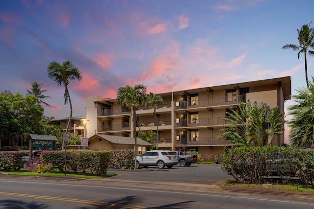 view of outdoor building at dusk