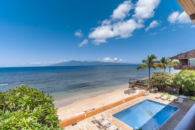 view of water feature featuring a beach view and a mountain view