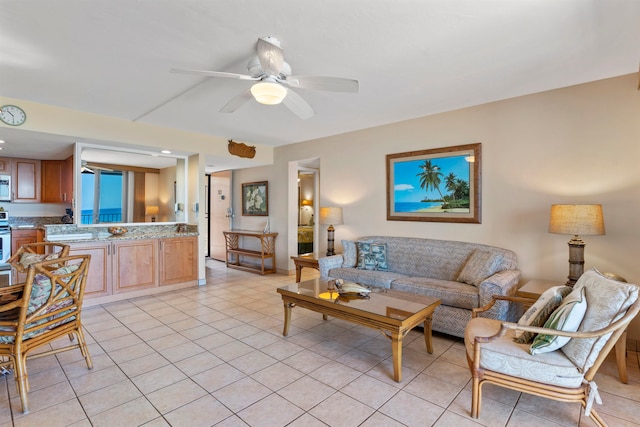 tiled living room with ceiling fan