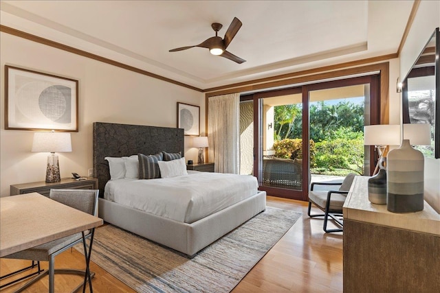 bedroom with access to exterior, ceiling fan, and light hardwood / wood-style floors