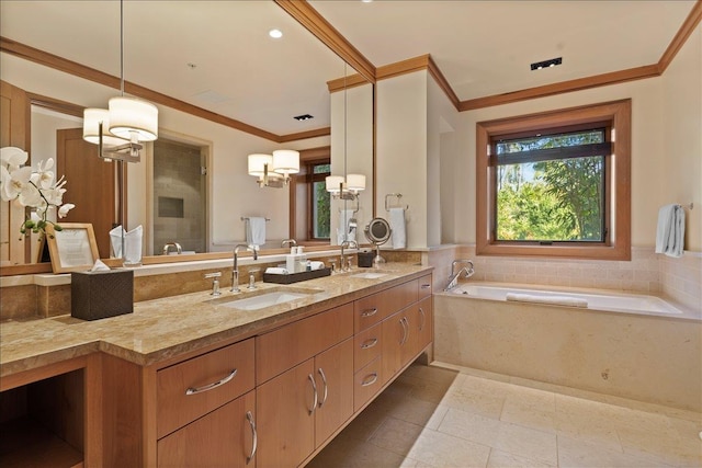 bathroom with a bathtub, vanity, ornamental molding, and tile patterned flooring