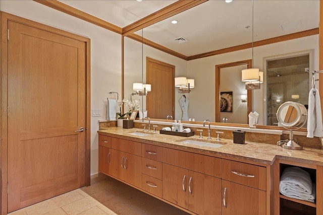 bathroom featuring tile patterned flooring, vanity, a shower with door, and crown molding