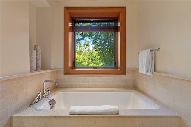 bathroom with tiled bath