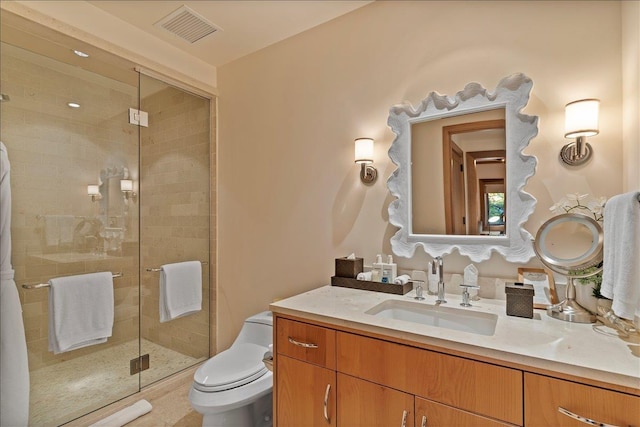 bathroom featuring vanity, toilet, and an enclosed shower