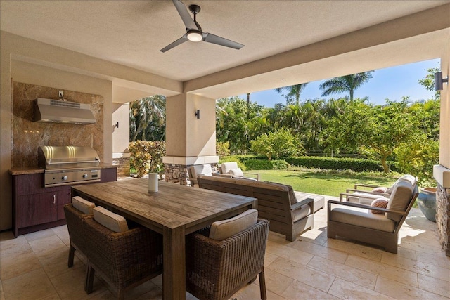 view of patio / terrace with an outdoor hangout area, grilling area, exterior kitchen, and ceiling fan