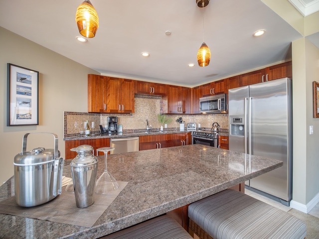 130 Kai Malina Pkwy Unit 719, Lahaina, HI 96761 - kitchen featuring stainless steel appliances, a breakfast bar area, decorative backsplash, hanging light fixtures, and recessed lighting