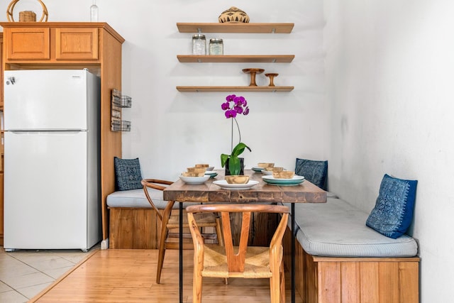 dining space with breakfast area and light wood-type flooring