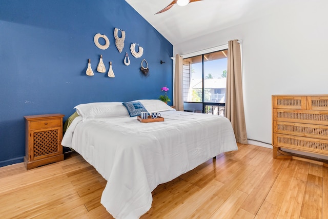 bedroom with access to exterior, wood-type flooring, and ceiling fan