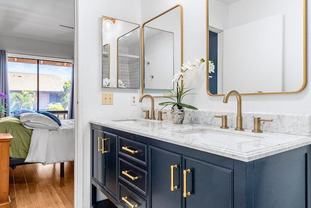 bathroom with vanity and hardwood / wood-style flooring