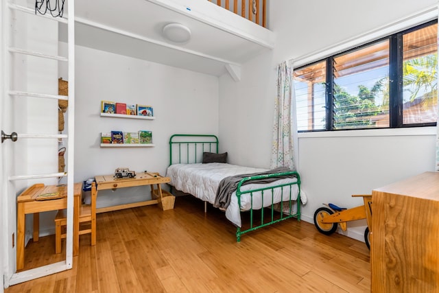 bedroom featuring wood-type flooring