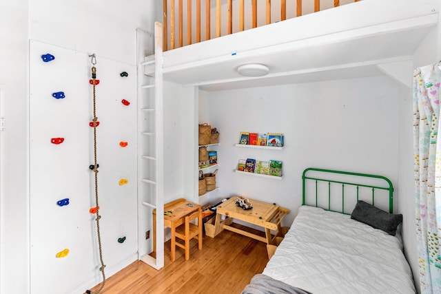 bedroom featuring hardwood / wood-style floors