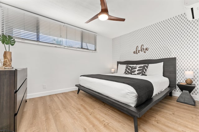 bedroom featuring light hardwood / wood-style flooring and ceiling fan