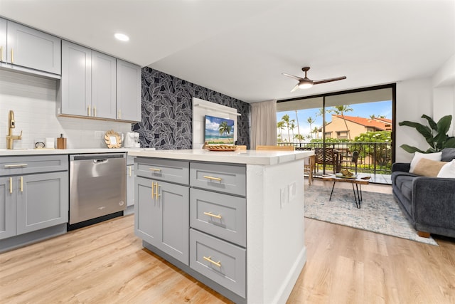 kitchen featuring floor to ceiling windows, ceiling fan, light hardwood / wood-style floors, dishwasher, and gray cabinetry