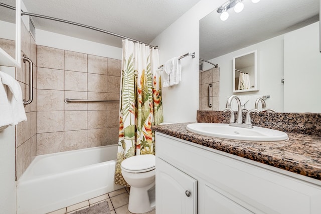 full bathroom featuring shower / tub combo with curtain, vanity, a textured ceiling, tile patterned floors, and toilet