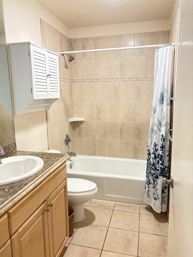 bathroom featuring toilet, shower / bathtub combination with curtain, vanity, and tile patterned floors