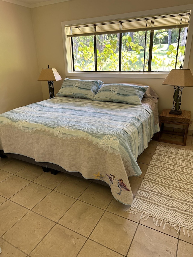 tiled bedroom with multiple windows