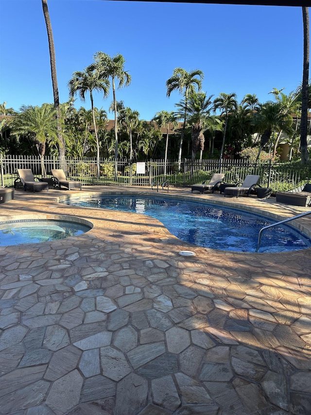 view of pool featuring a fenced in pool, fence, and a patio