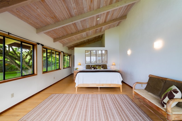 bedroom with wood ceiling, light hardwood / wood-style floors, and lofted ceiling with beams