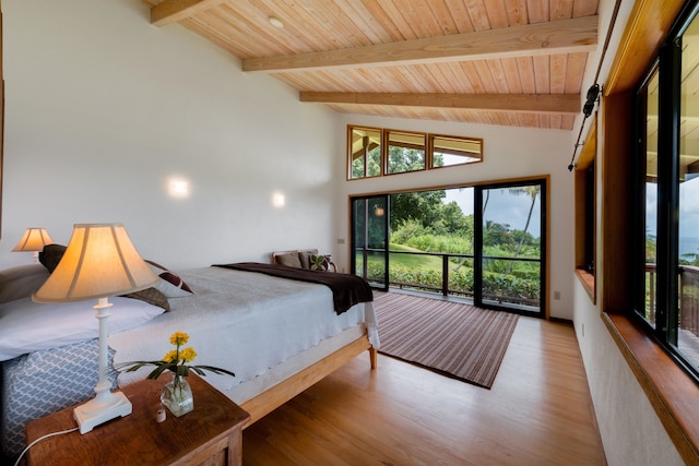 bedroom with beamed ceiling, high vaulted ceiling, wooden ceiling, a barn door, and light hardwood / wood-style floors