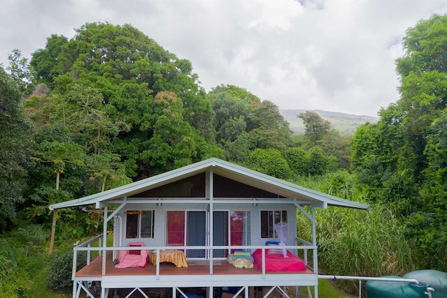 view of front of house with a wooden deck