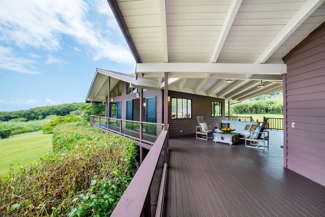 wooden terrace featuring an outdoor living space