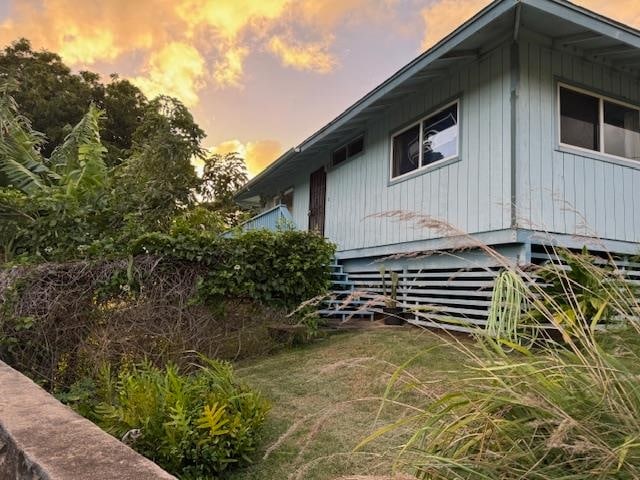 view of property exterior at dusk