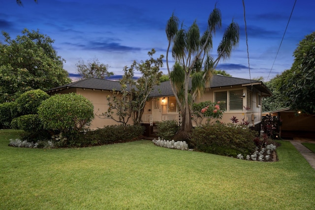 view of front of home featuring a lawn