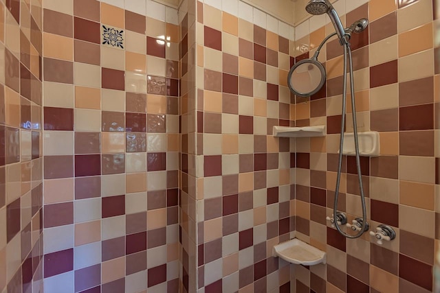 bathroom with tiled shower