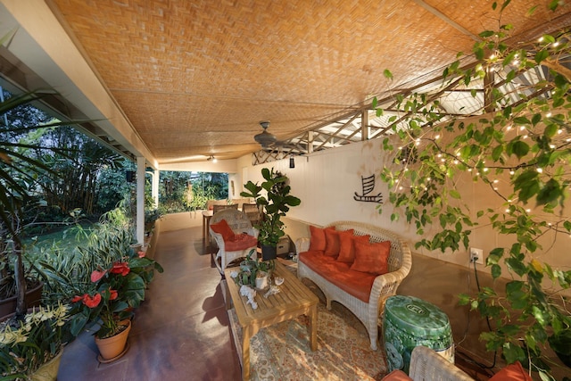 view of patio with an outdoor living space and ceiling fan