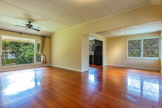 unfurnished room featuring hardwood / wood-style flooring and ceiling fan