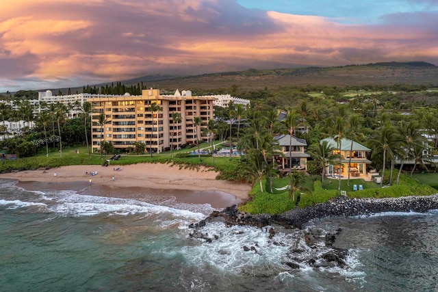 aerial view at dusk with a water view