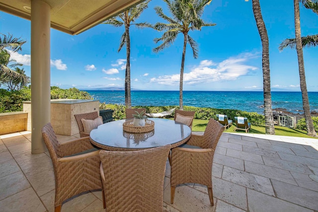 view of patio with a water view