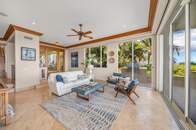 tiled living room with ornamental molding and ceiling fan