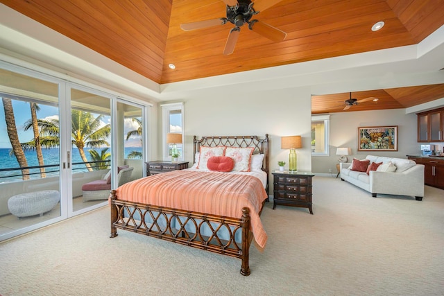 bedroom featuring ceiling fan, carpet, access to exterior, and wooden ceiling