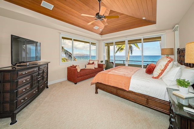 bedroom featuring ceiling fan, a water view, light carpet, access to outside, and wood ceiling