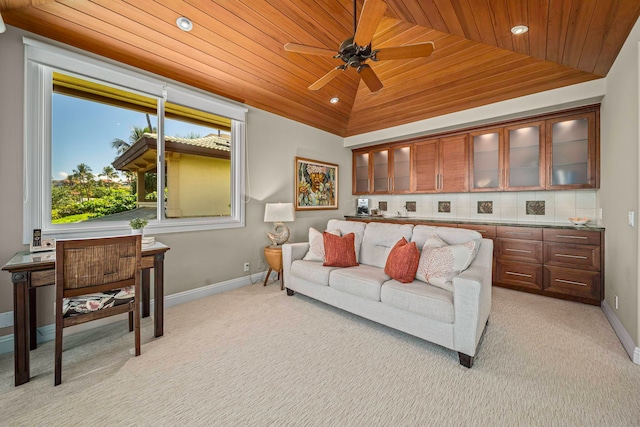 carpeted living room with wood ceiling, high vaulted ceiling, and ceiling fan