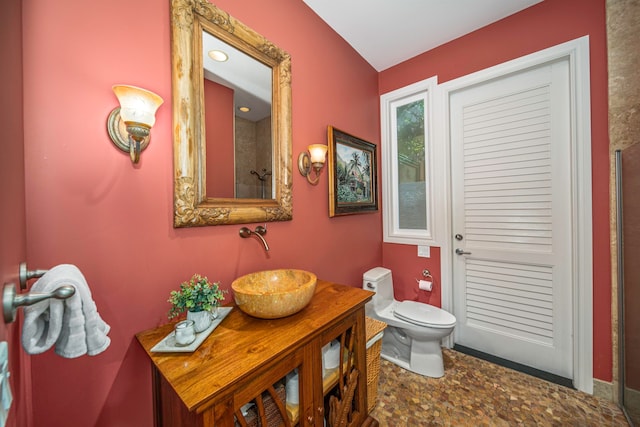 bathroom featuring tile patterned floors, toilet, and vanity