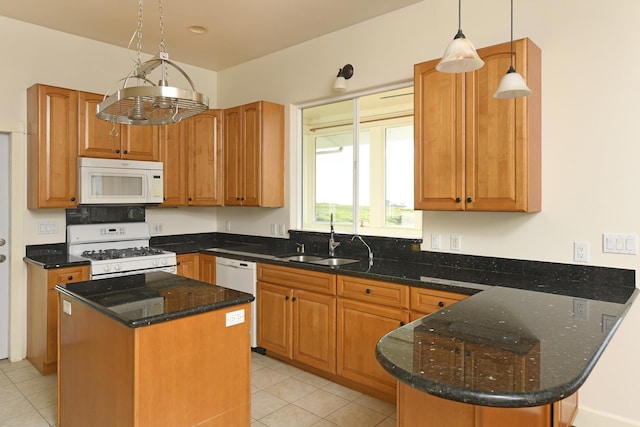 210 Napoko Pl, Kula, HI 96790 - kitchen with white appliances, a sink, dark stone counters, a peninsula, and light tile patterned floors