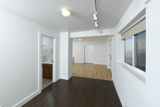 210 Napoko Pl, Kula, HI 96790 - hall with dark wood finished floors, baseboards, and track lighting