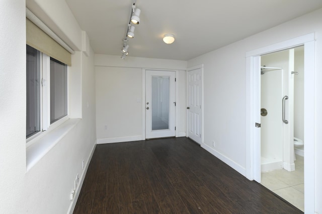 210 Napoko Pl, Kula, HI 96790 - hall featuring track lighting, wood finished floors, and baseboards