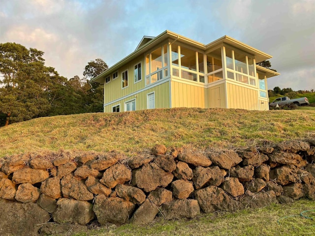 210 Napoko Pl, Kula, HI 96790 - view of home's exterior with board and batten siding and a sunroom