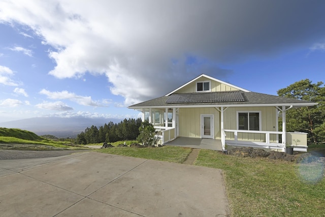 210 Napoko Pl, Kula, HI 96790 - view of front of property with a porch, board and batten siding, and a front yard