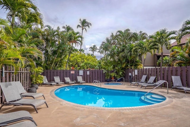 view of swimming pool with a patio area